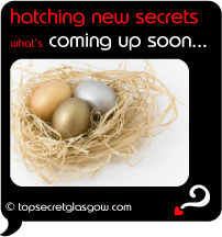 Top Secret Quote Bubble in black, nest of gold and silver eggs